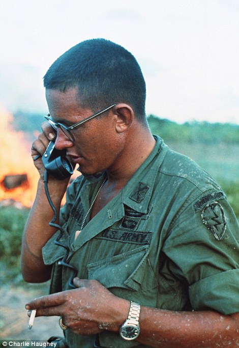 Technology: An American officer talking on a field telephone, an early precursor to the now-ubiquitous mobile phone